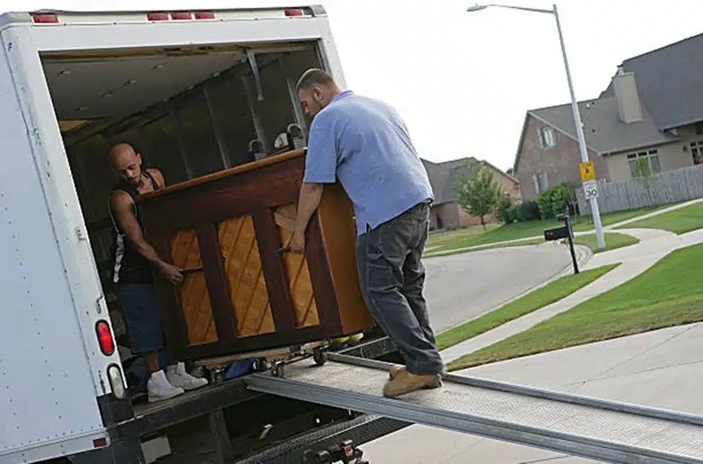 moving a piano into a truck