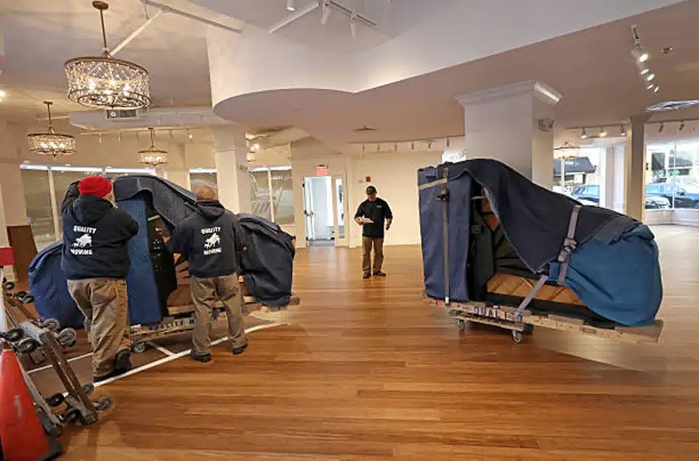 professional piano movers moving two pianos